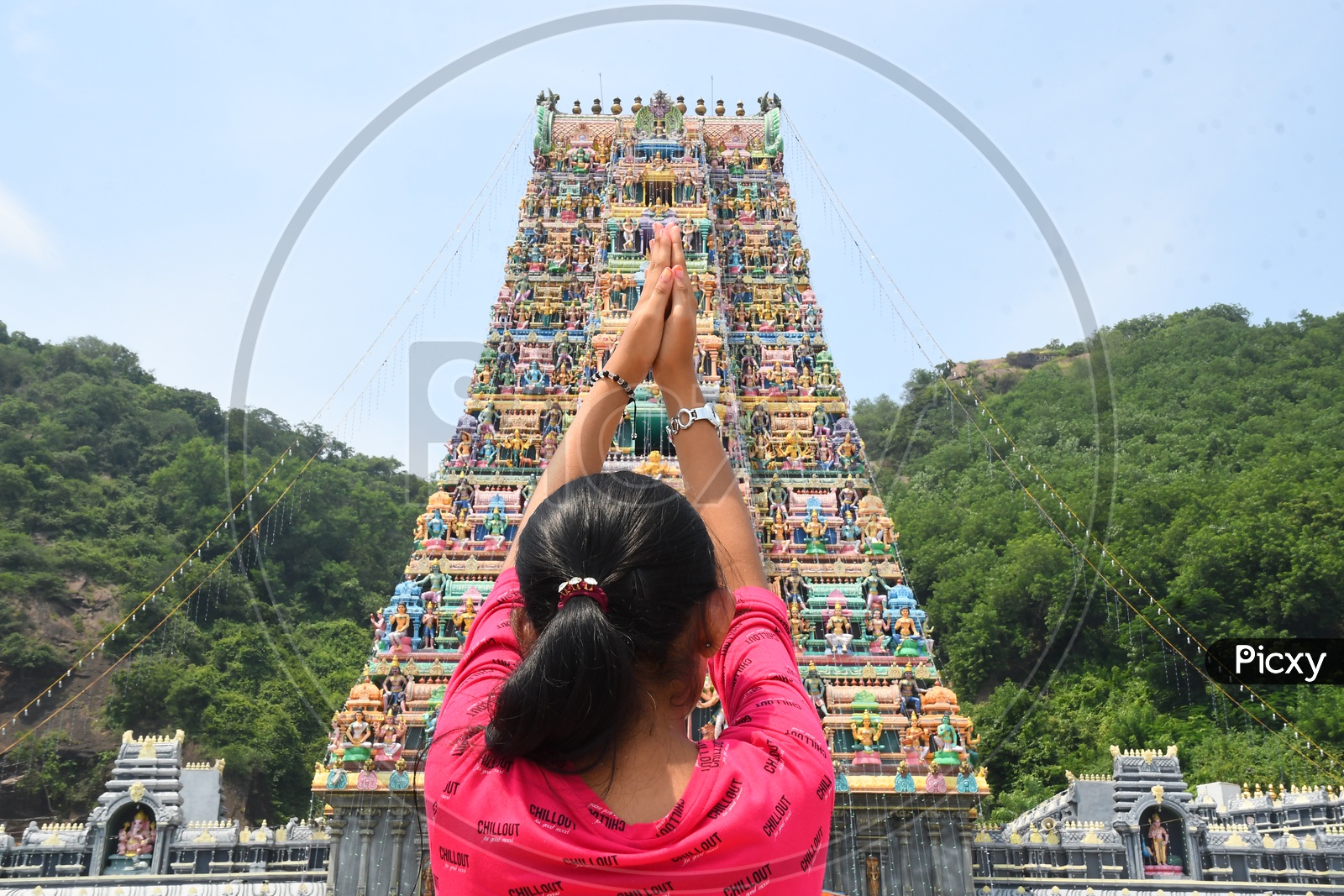 A Girl Praying to God at a Temple