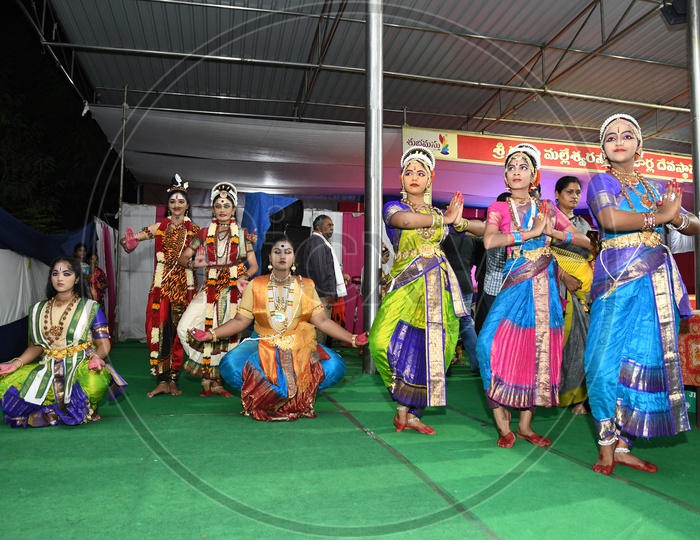 Indian Classical Dancers Performing On Stage At an Cultural Event
