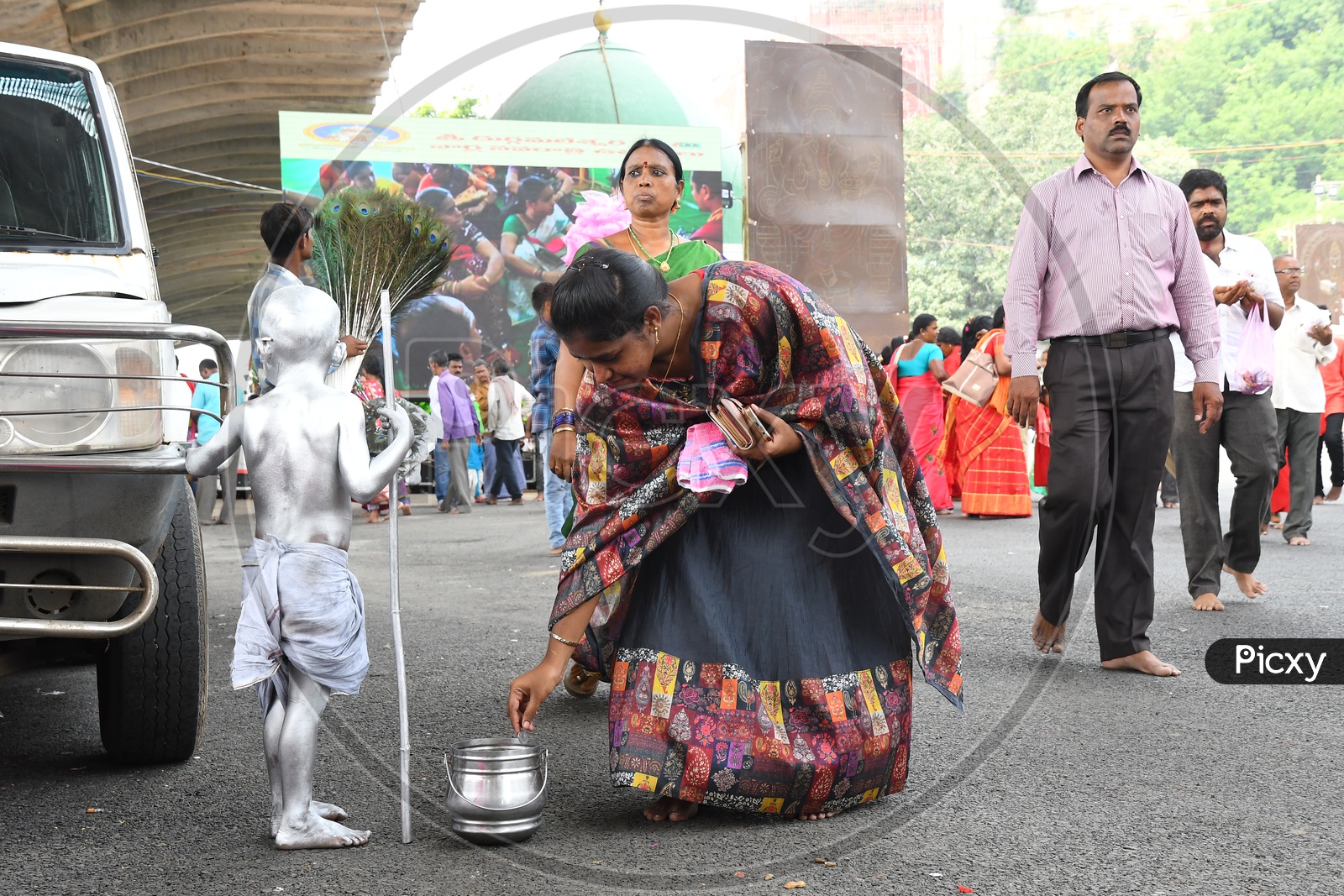 A Kid Painted as Mahatma Gandhi begging on streets