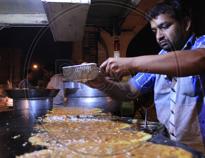 Man Preparing Dosa  at A Famous Dosa Stall Called Ram Ki Bandi In Hyderabad