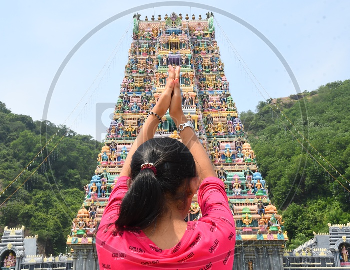 A Girl Praying to God at a Temple