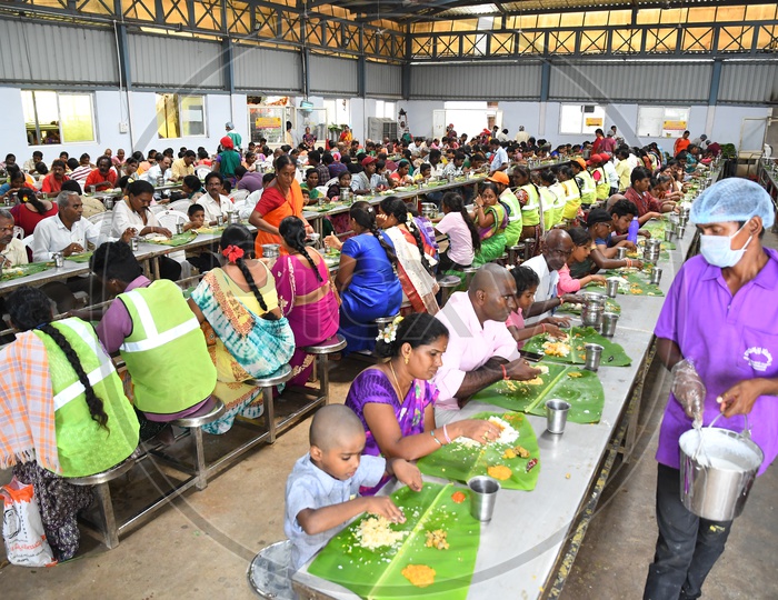Devotees Eating Food in a Temple, annaprasadam
