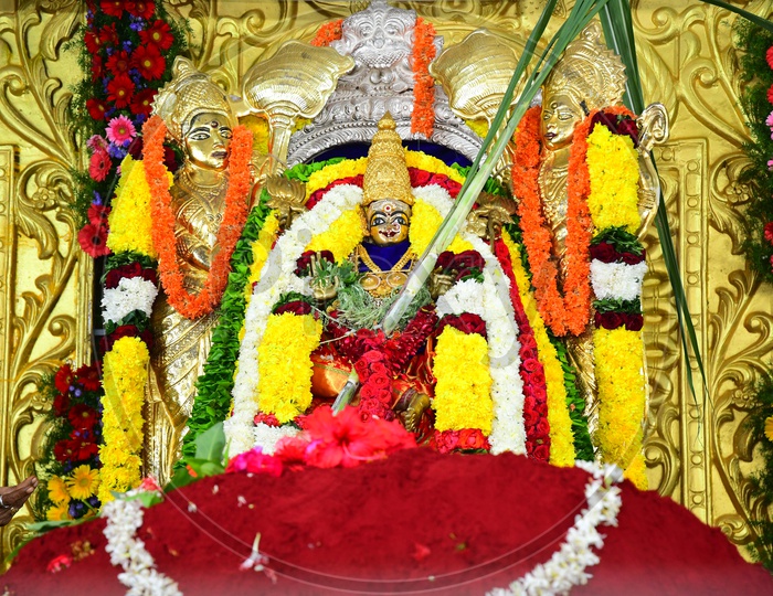Indian Hindu Goddess Statue decorated with garlands in the temple