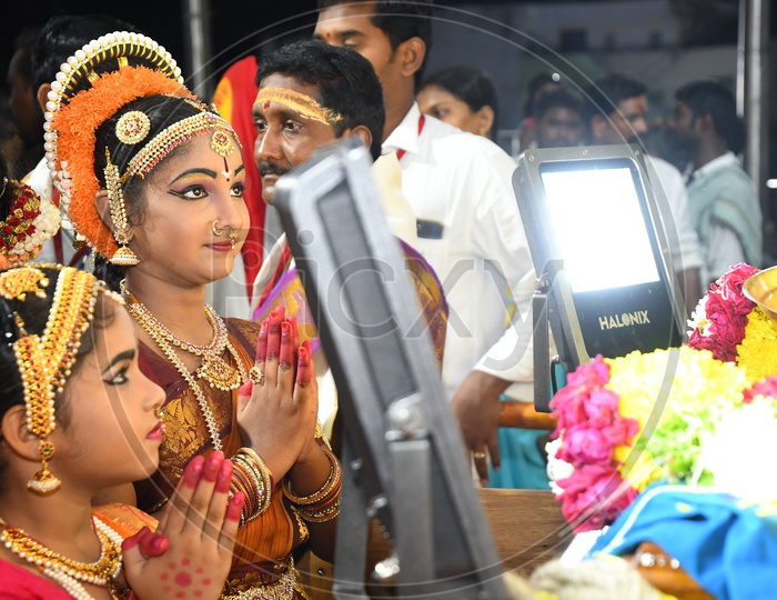 Female Dancers Praying to God before a Performance