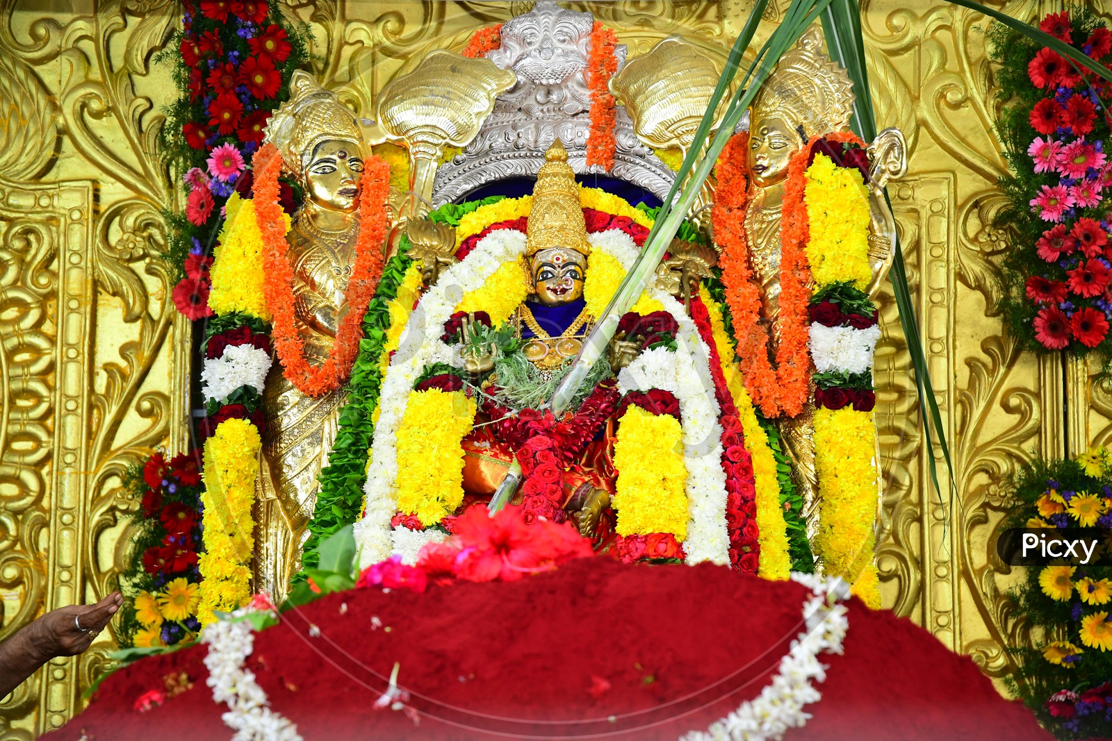 Indian Hindu Goddess Statue decorated with garlands in the temple