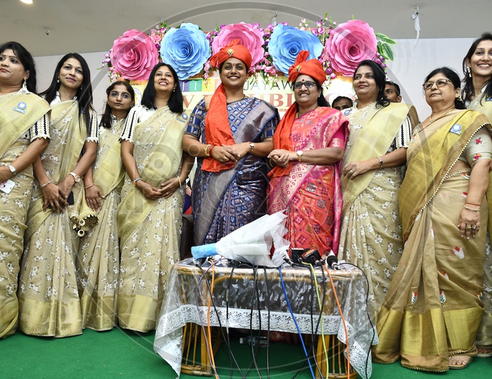 Staff and Women taking a group picture with  APIIC Chief and Nagari MLA RK Roja
