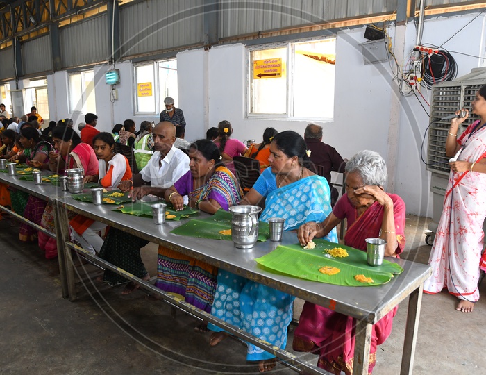 Volunteers Serving Food At Annadaanam Or Food Donation Dining hall  by Hindu God Devastanams
