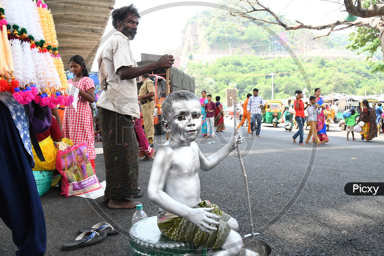 Indian Boy or Street Artist  As Mahatma Gandhi Getup And Pained in Silver