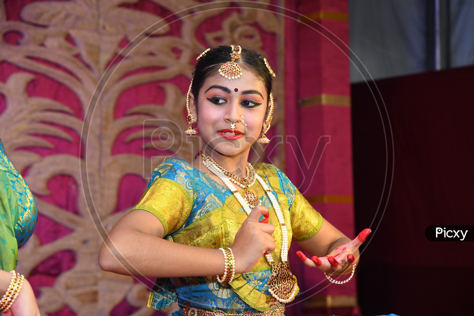 Indian dancer girl in the middle of her performance during Dussehra