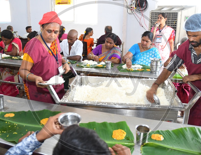 A Volunteer Service Food to Devotees in a Temple, Anna Prasadam