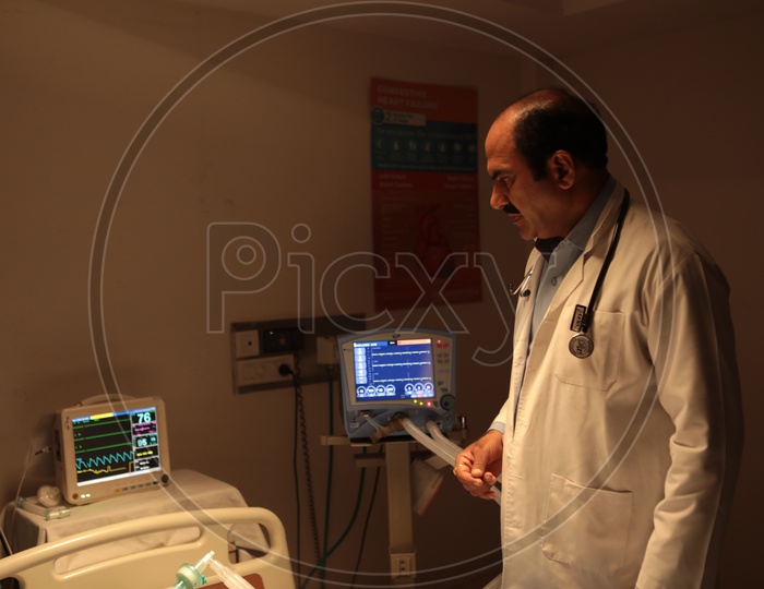 A Doctor observing the patient