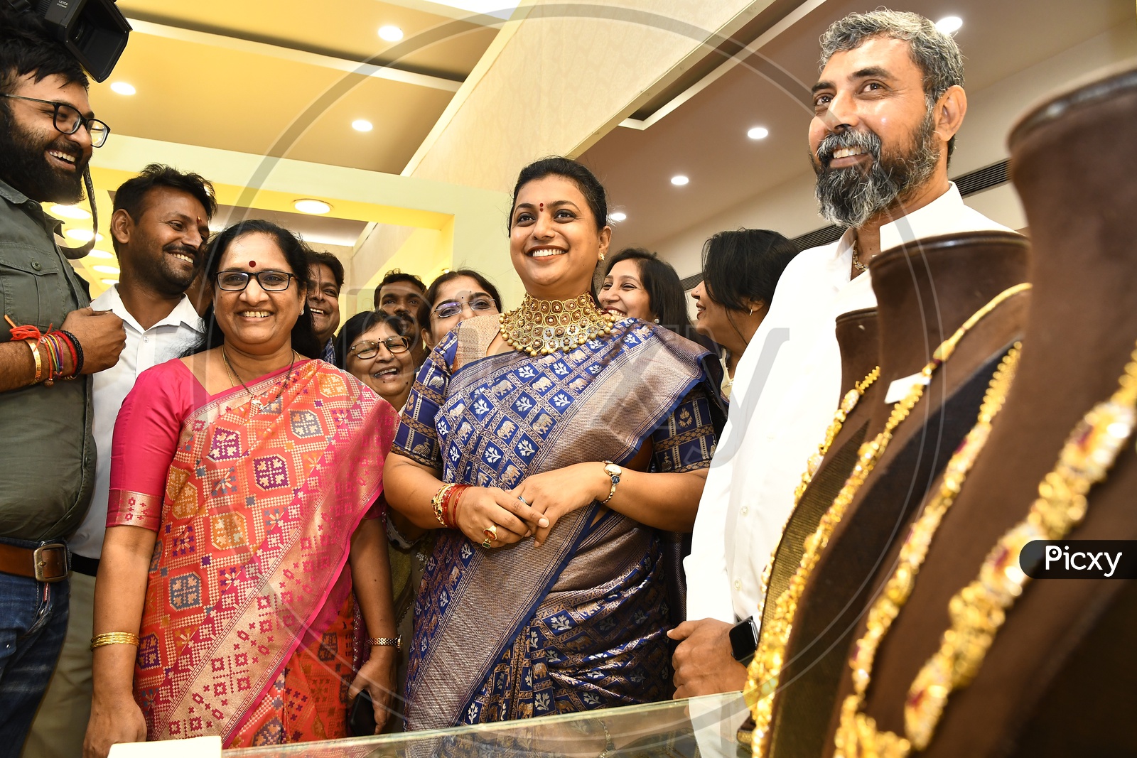 APIIC Chief and Nagari MLA RK Roja trying the Desinger Necklace
