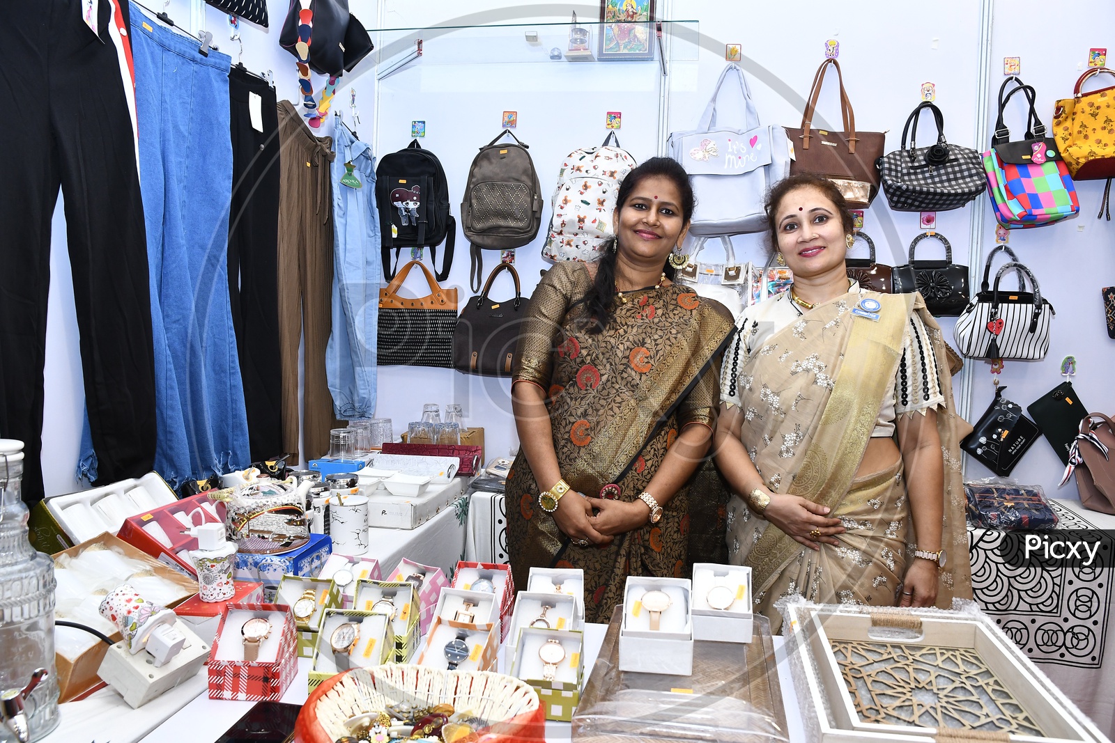 Women with their customized jewelry for sale in the exhibition