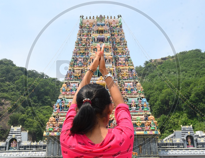 A Girl Praying to God at Temple