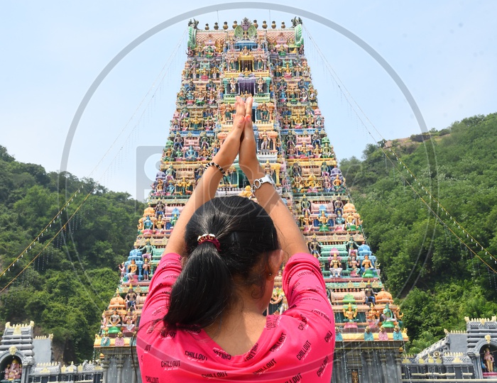 Young Girl Praying To Temple Shrine