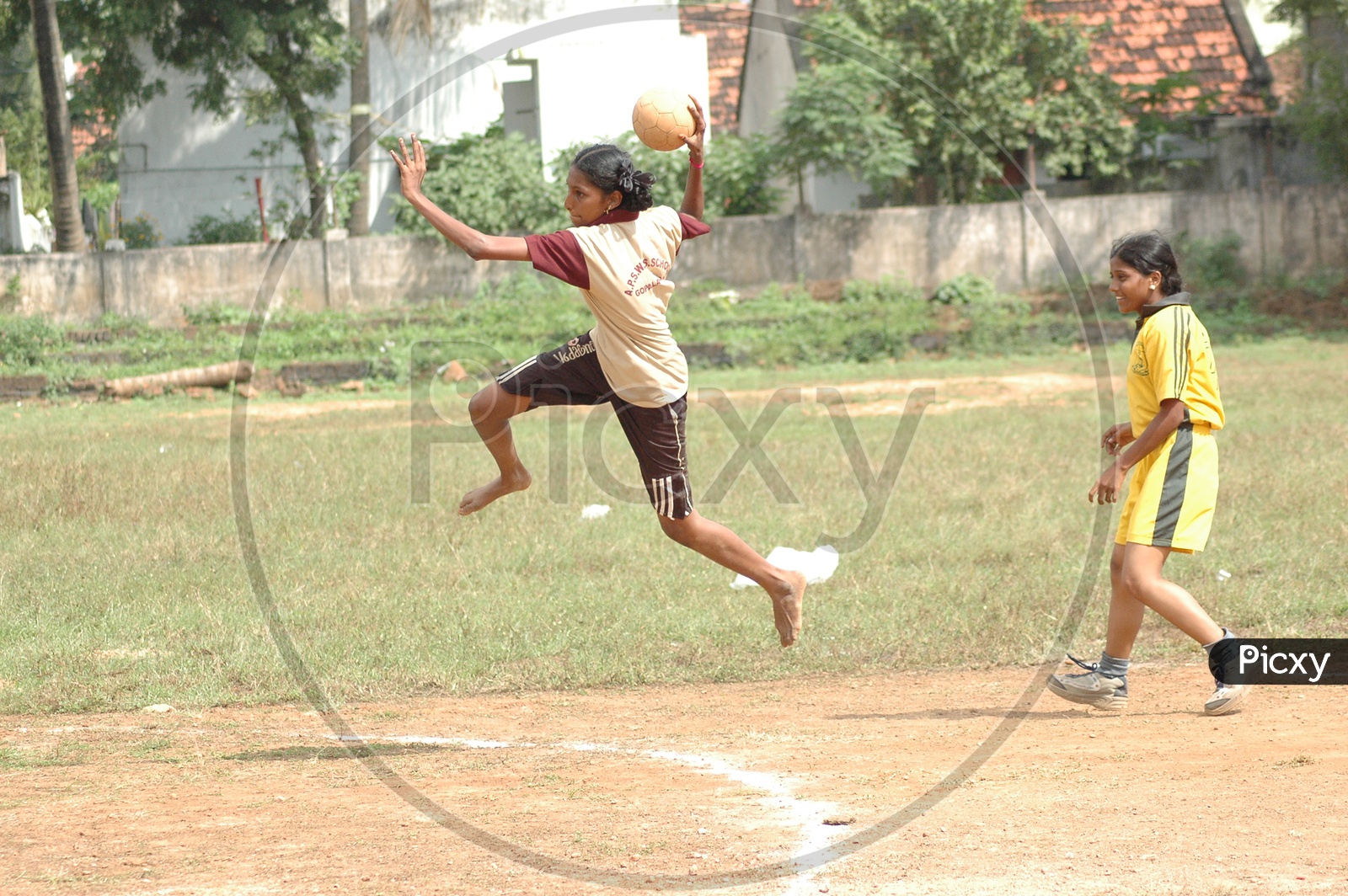 School girls playing throw-ball