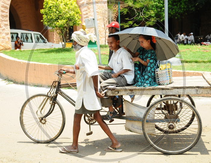 Indian Physically Handicapped people going on a Rickshaw