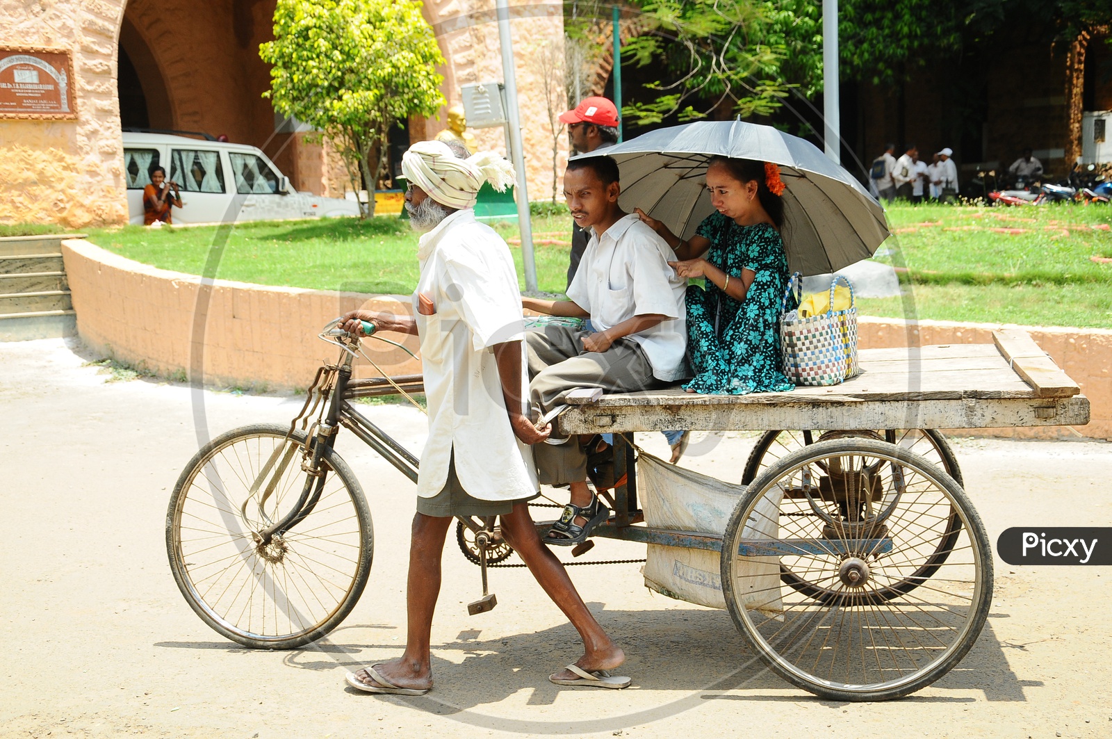 Indian Physically Handicapped people going on a Rickshaw