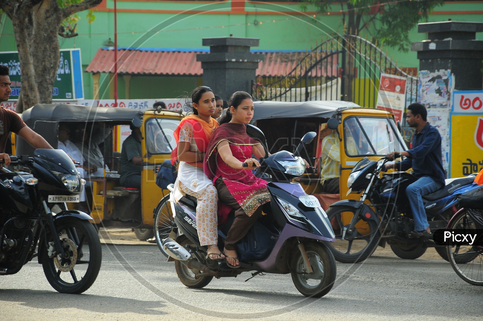 Indian College Girls riding Scooty