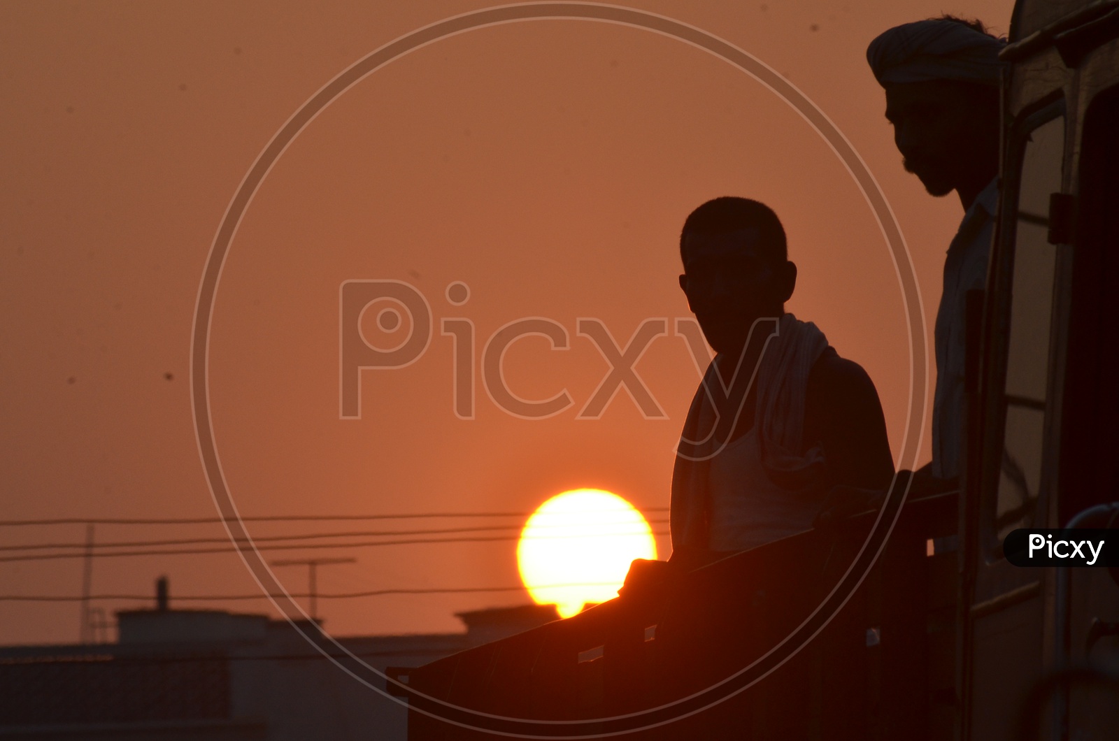 Silhouette of elderly men during sunset