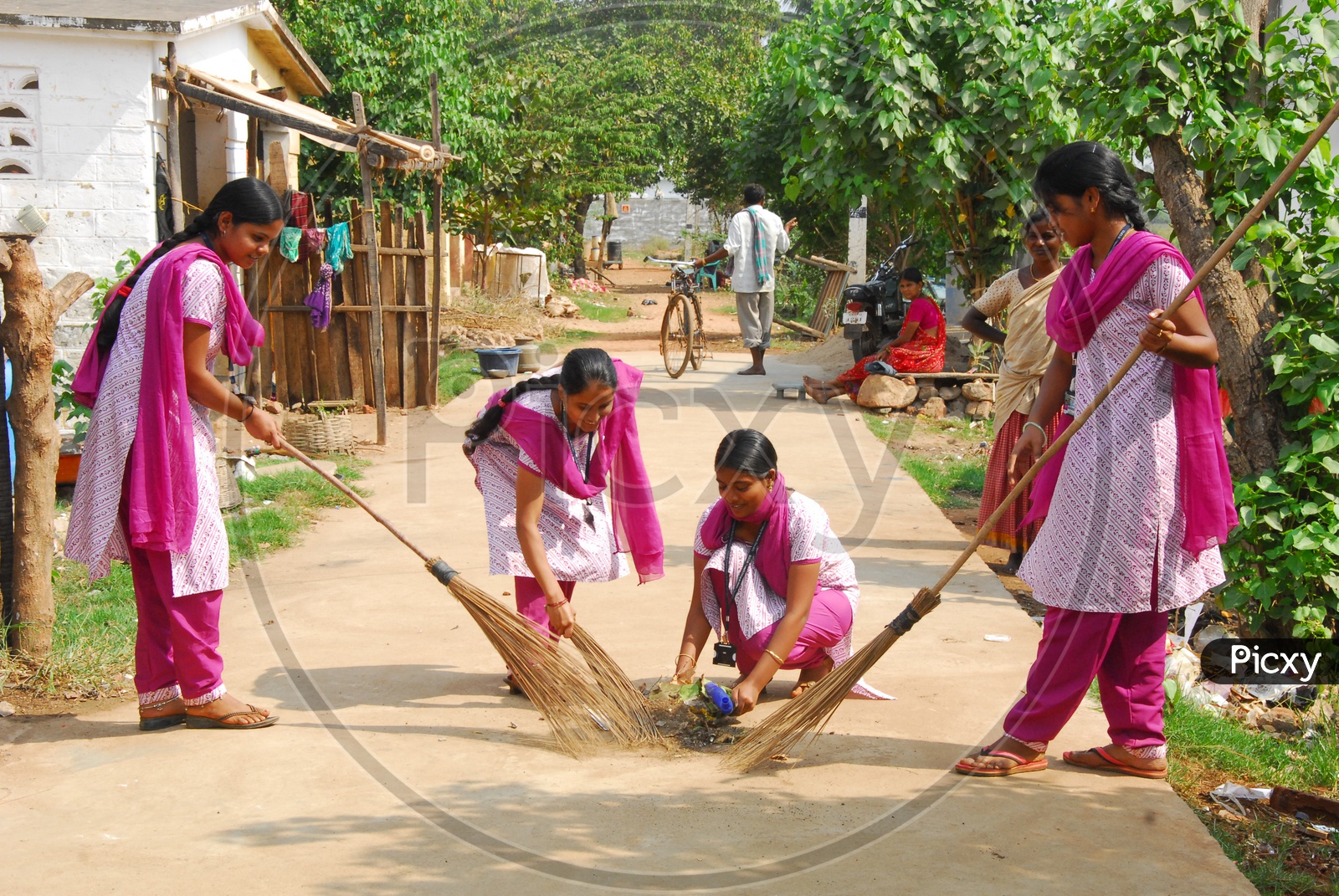College Volunteer Girls cleaning the village