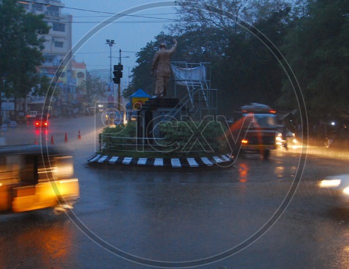 View of Former AP CM  LATE YS Raja Sekhar Reddy Statue during Rain