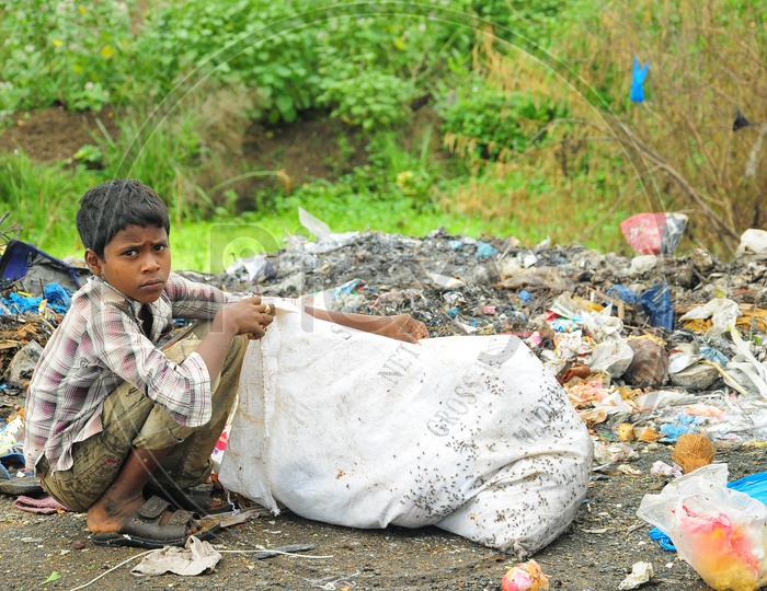 Image of A Rag Picker kid collecting trashSO165596Picxy
