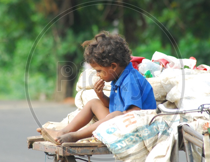 Indian boy child sitting on the rickshaw