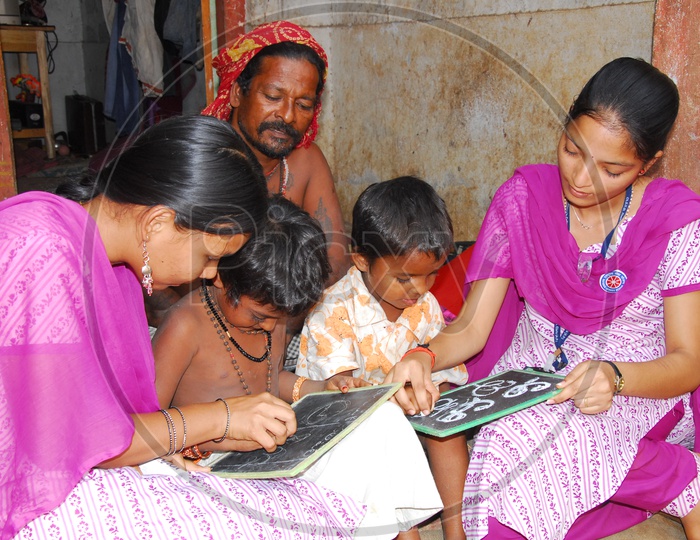 Indian College Volunteer girls teaching kids