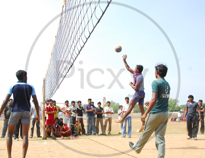 College Students playing Volley Ball