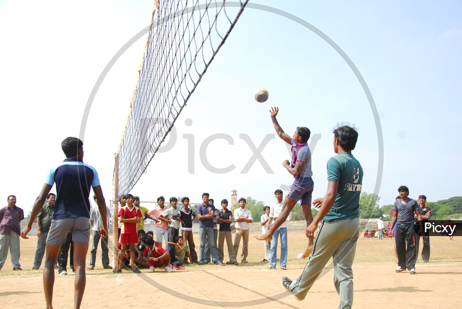 College Students playing Volley Ball