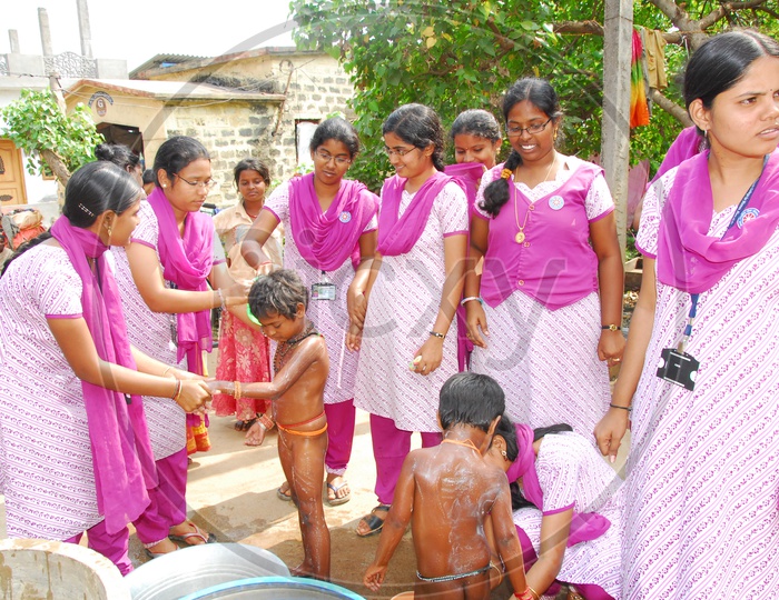 Indian College Volunteer girls bathing street kids