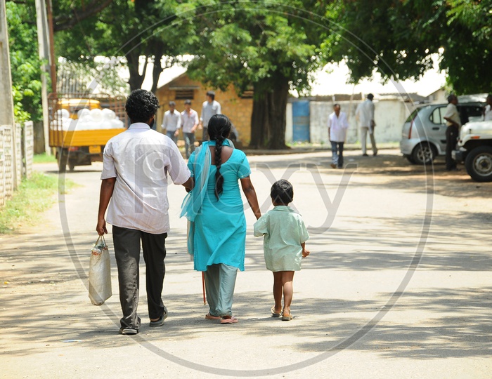 An Indian Family walking on the road