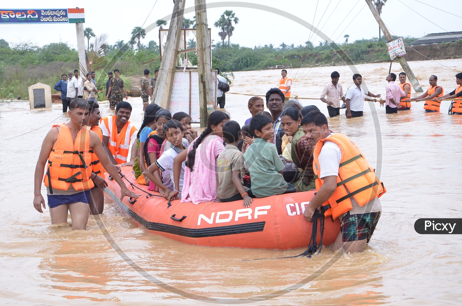 NDRF Flood Rescue Team helping people during floods in Eluru