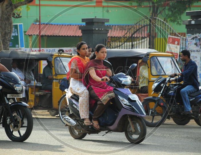 Image Of Indian Girls Riding Scooty During Heavy Rains Pd935988 Picxy 7539