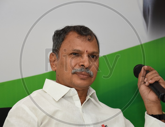 Chairman of 20 Point Program committee, Narreddy Tulasi Reddy holding a mic