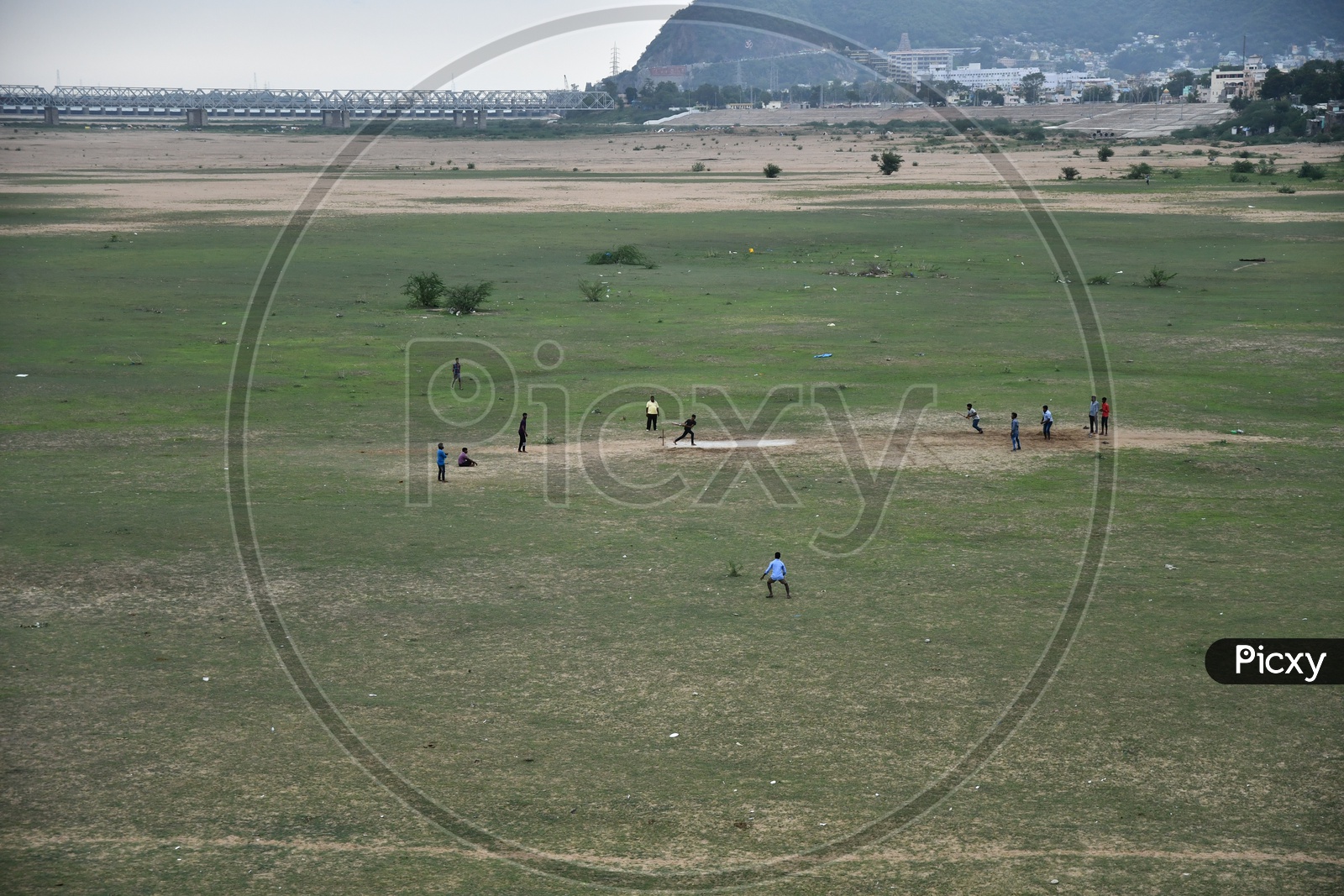 Unidentified People Playing Cricket on Sand at Vijayawada