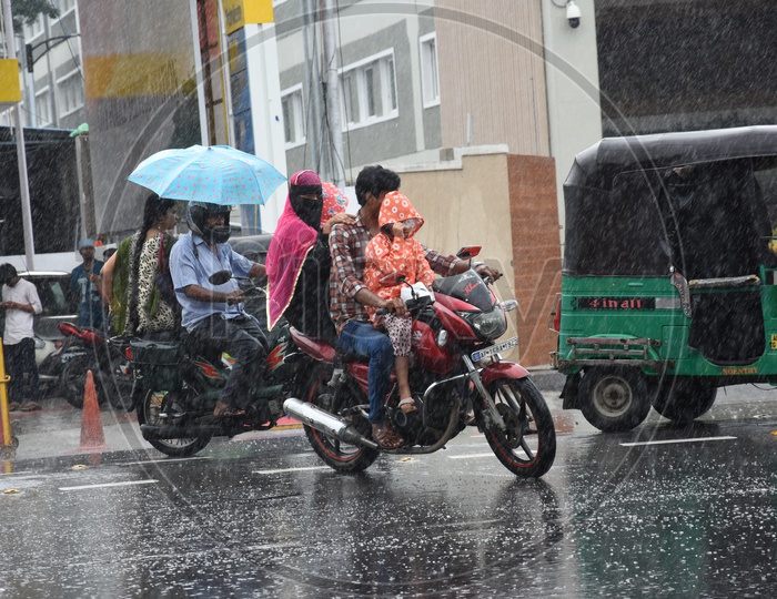 A Family on Bike while raining, Vijayawada