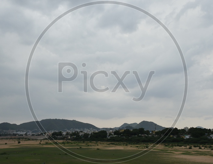 Vijayawada Cityscape with Clouds in Sky Background