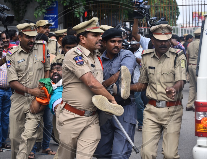 A congress party worker being arrested by the Police as he protests at Pragathi Bhawan after Congress party calls for a Gherao of  CM KCR's residence