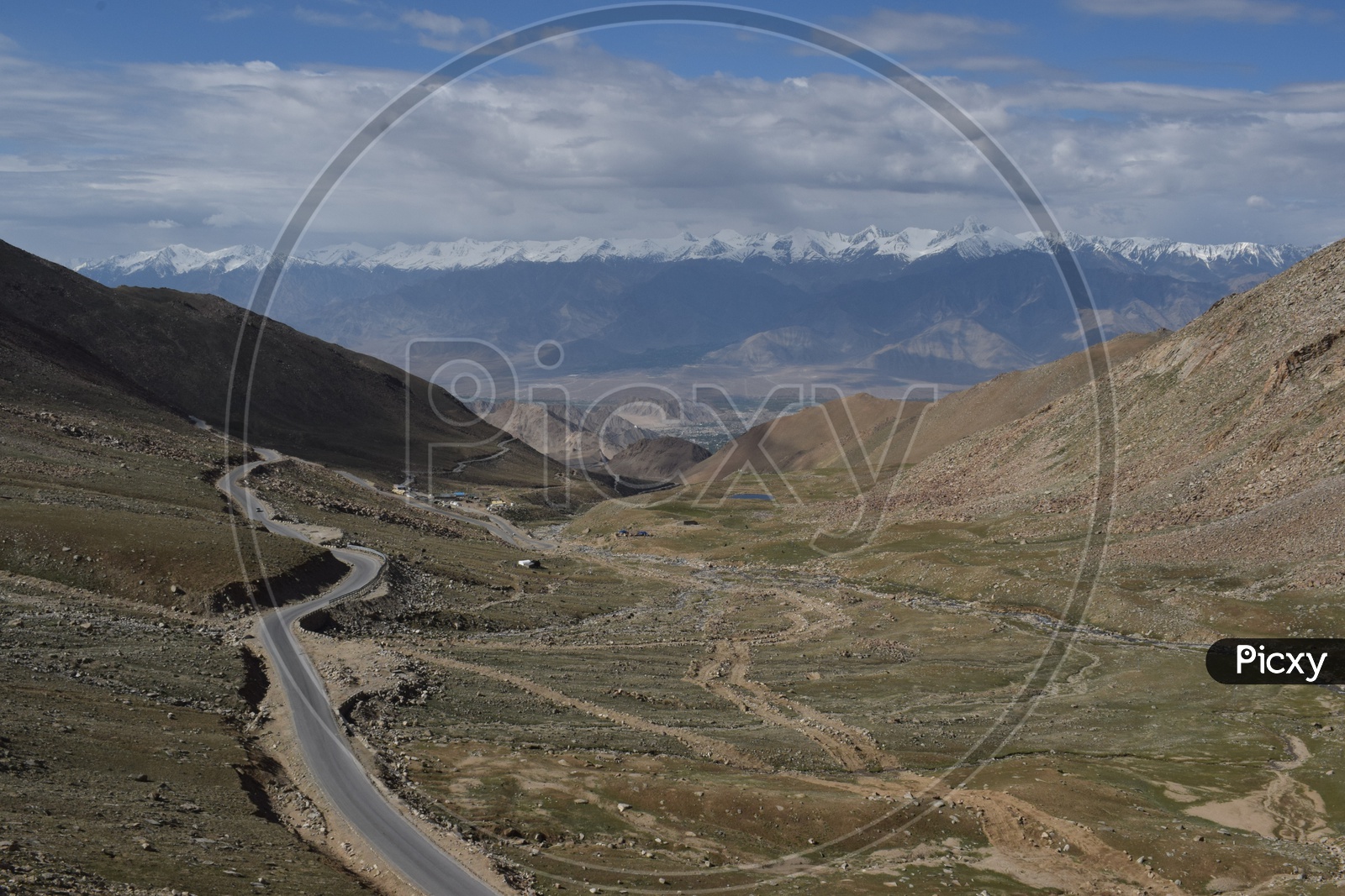 Highway as viewed from the top with the backdrop of Himalayas