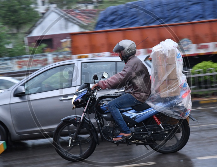 Two Wheeler Commuters Commuting in Rain