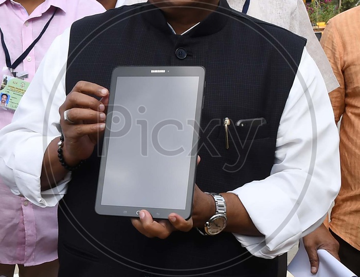 Yanamala Rama Krishnudu With A Tablet Gadget
