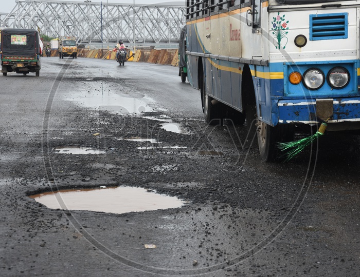 APSRTC Bus moving along the Damaged Road in Vijayawada due to heavy rains