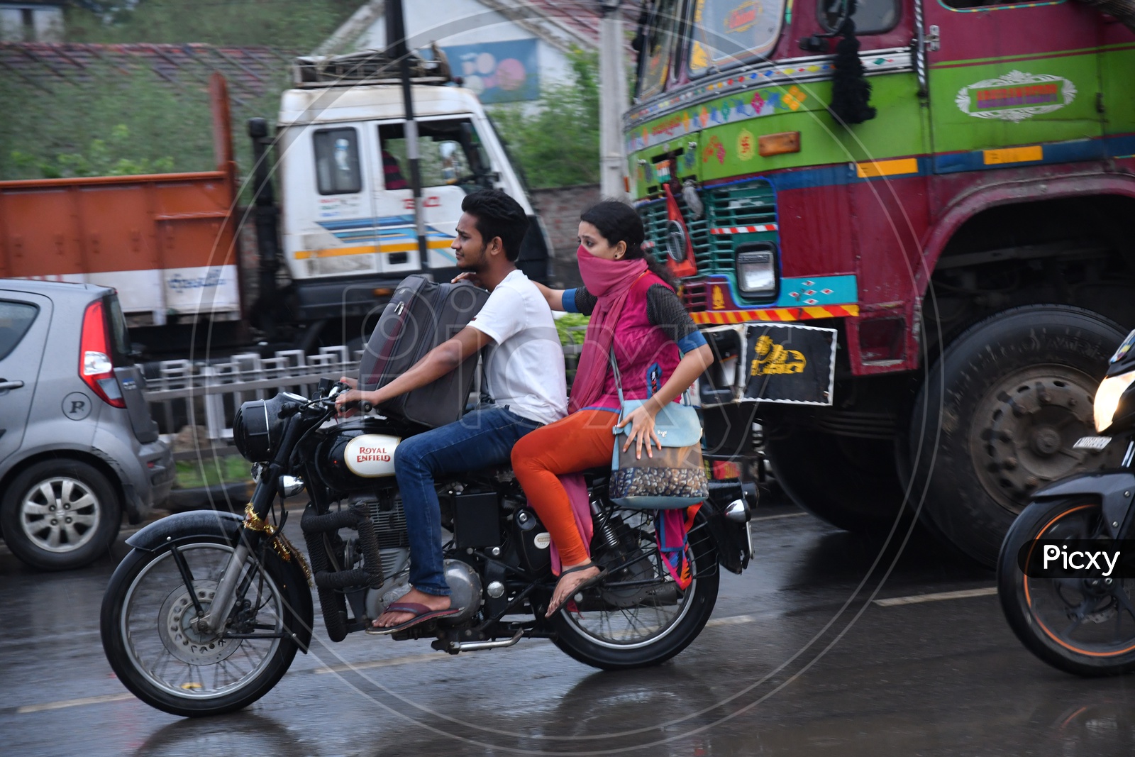 Unidentified People Driving Bike without Helmet