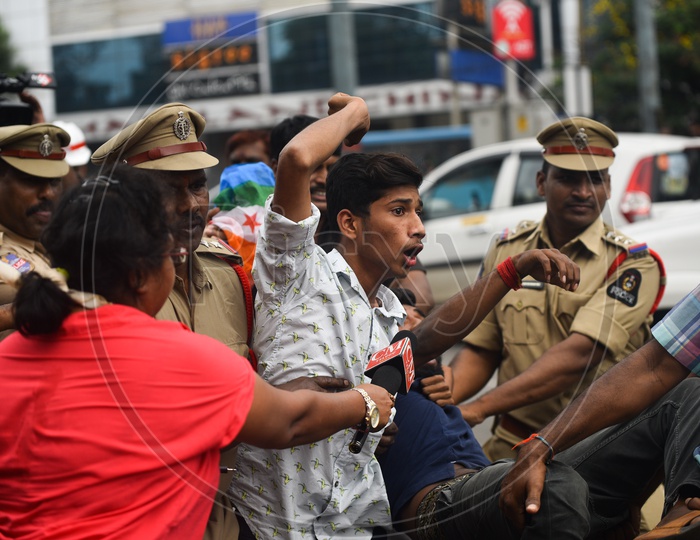 youth being detained into a van by Telangana Police as he protests at Pragathi Bhawan Gherao on 21st October,2019