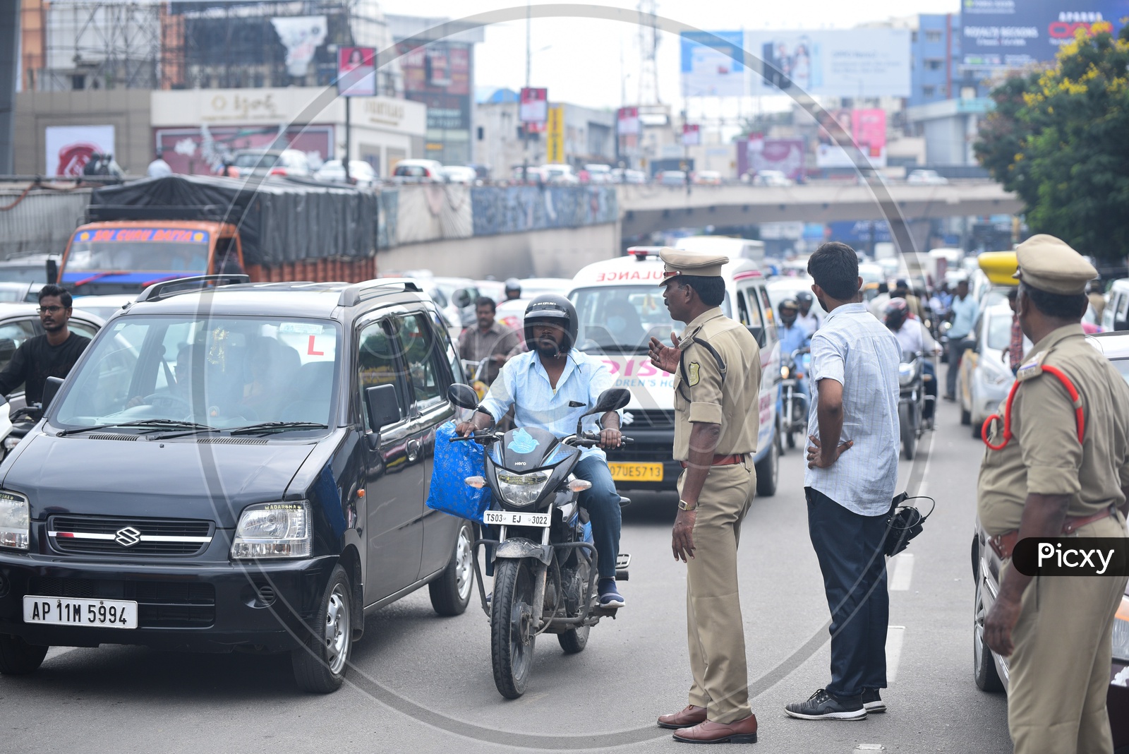 A policeman controls traffic at Pragathi Bhawan, Punjagutta