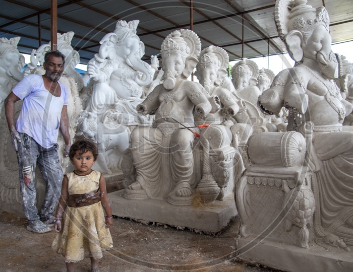 A Small Child At Ganesh Idol Making Workshop