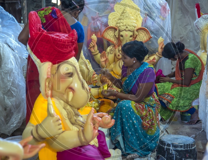 Lord Ganesh Idol Making By Artists Giving Final Finishing in Workshops For Ganesh Chathurdhi Festival