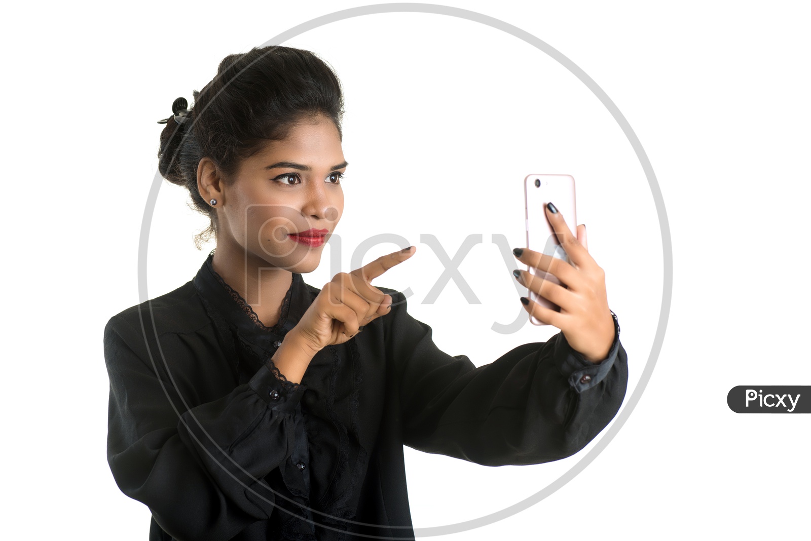 Image of Young Indian Woman Making a Video Call Or Video Chat In Smartphone  With an Expression On an Isolated White Background-AL640513-Picxy